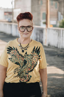 Faith Allison Mascato in a mustard eagle tee